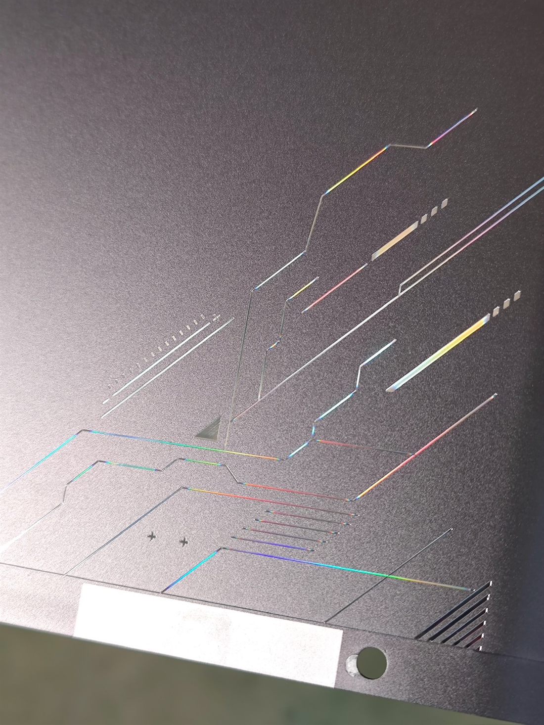Diamond-cut rainbow detail on the grey cover