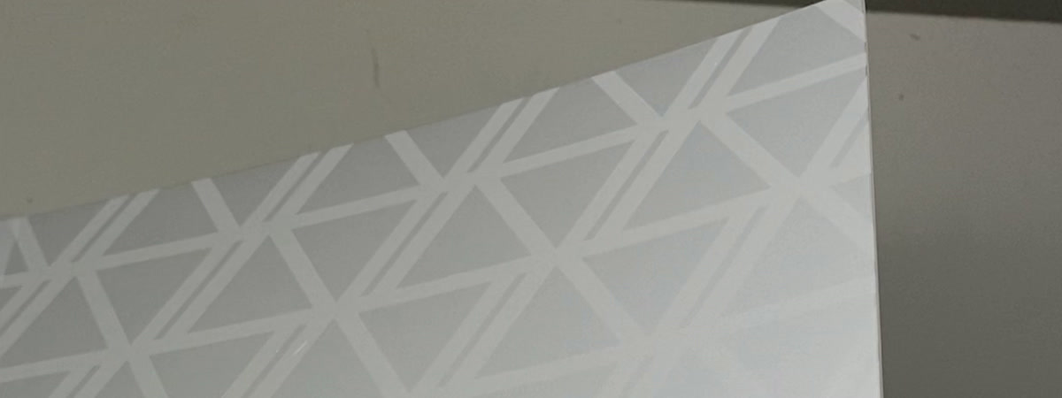 IMR film under light, the metallic triangle pattern catching as it tilts